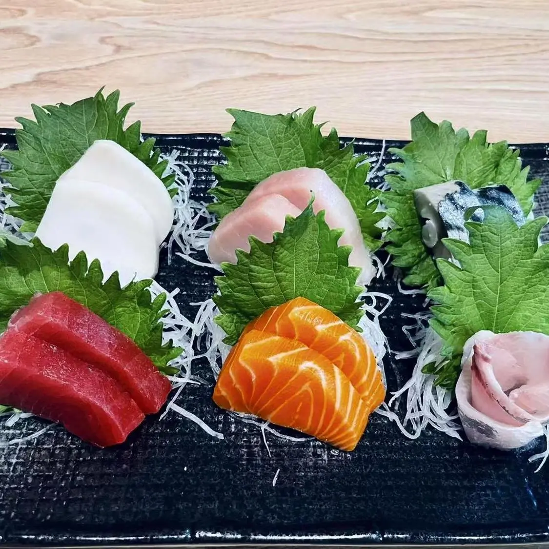 Shin Sushi-Japanese-restaurant-Assorted-Sashimi-Platter-Pleasant-Hill Assorted Sashimi Platter Fresh sashimi with shredded radish and shiso leaves at Shin Sushi, a Japanese restaurant in Pleasant Hill